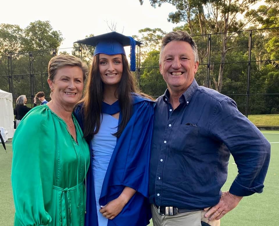 Josie on Graduation Day with her proud parents